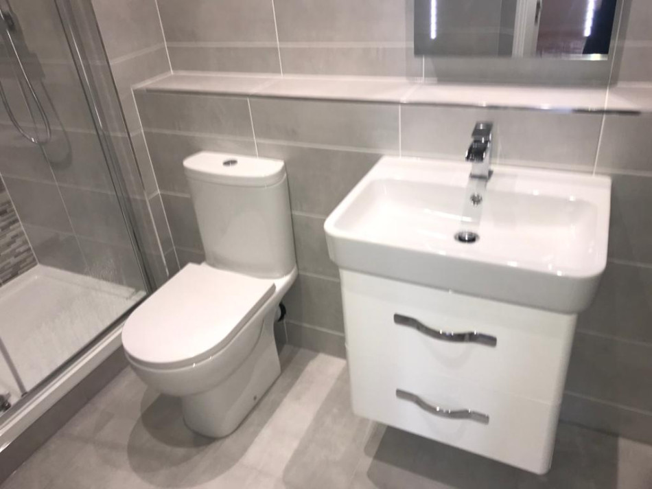 Stylish Bathroom Installation featuring Toilet and Vanity Unit